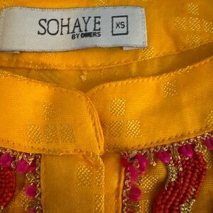 Yellow Blouse with Pink Embellishments